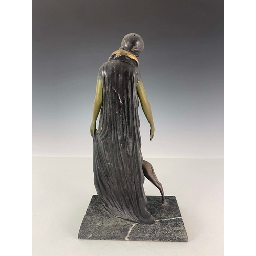 558 - Georges Van Der Voorde, an Art Deco patinated art metal figure group, circa 1925, modelled as a woma... 