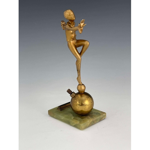 559 - Josef Lorenzl, an Art Deco gilt art metal figural table lighter, circa 1925, modelled as a dancing w... 