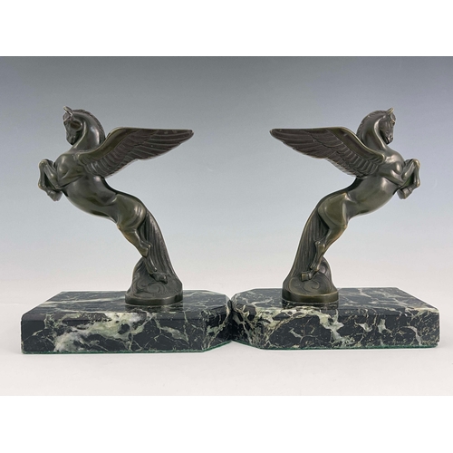 562 - Maurice Frecourt, a pair of Art Deco bronze Pegasus bookends, circa 1925, each modelled as the winge... 