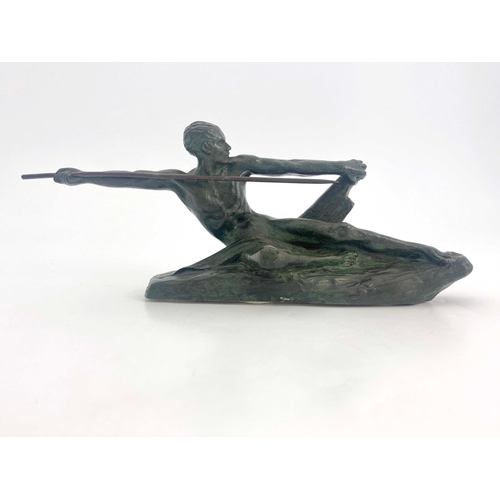 570 - Max Le Verrier, Spear Hunter, a small Art Deco bronze figure, circa 1925, modelled as a reclining ma... 