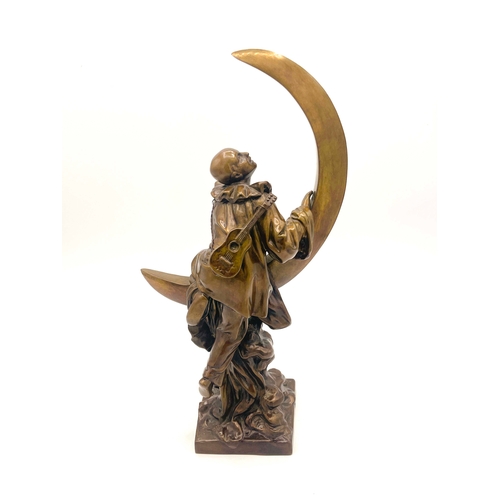 572 - Alfred Jean Foretay, Pierrot Lune, an Art Deco bronze figure, circa 1925, modelled as the clown clim... 