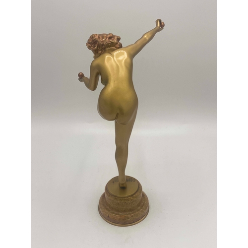 575 - Claire Colinet, Juggler, an Art Deco gilt bronze figure, circa 1925, modelled as a nude woman with t... 