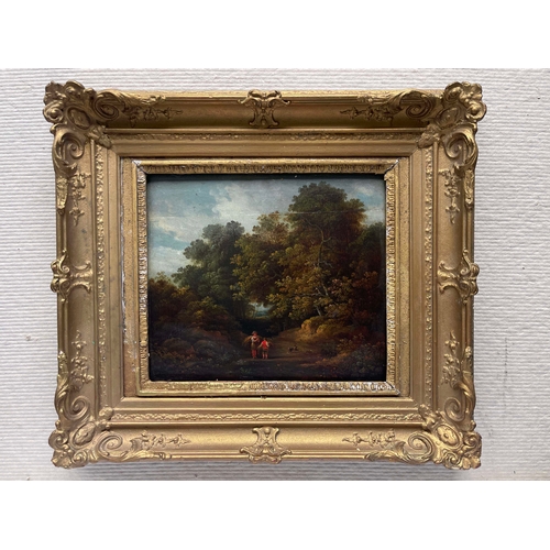 672 - English School, mid 19th Century, a wooded landscape with figures carrying straw and a dog, oil on p... 