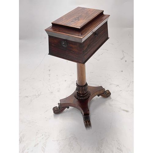 725 - A Regency rosewood teapoy, circa 1820, of sarcophagus form, the hinged cover opening to a fitted int... 