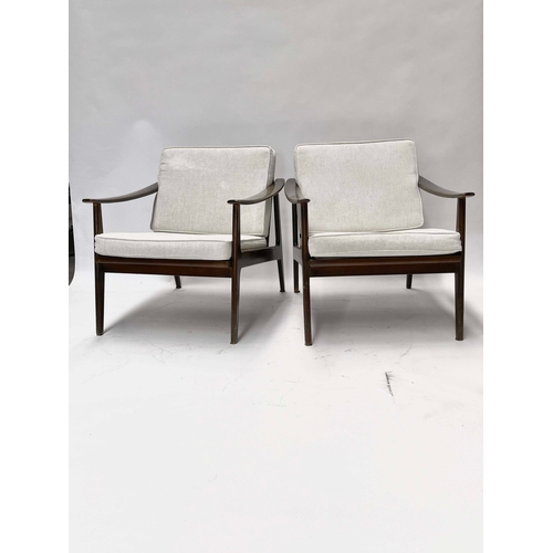 754 - A pair of lounge armchairs, circa 1950s, in the manner of Ole Wanscher, stained beech frames with sp... 