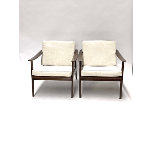 754 - A pair of lounge armchairs, circa 1950s, in the manner of Ole Wanscher, stained beech frames with sp... 