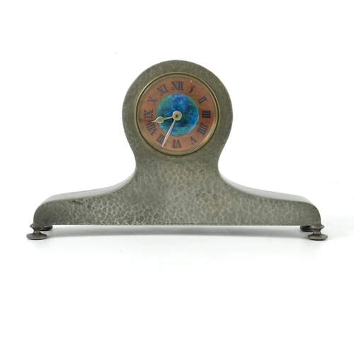 766 - Liberty and Co., an Arts and Crafts Tudric pewter and enamelled mantle clock, model 01294, the 2 inc... 