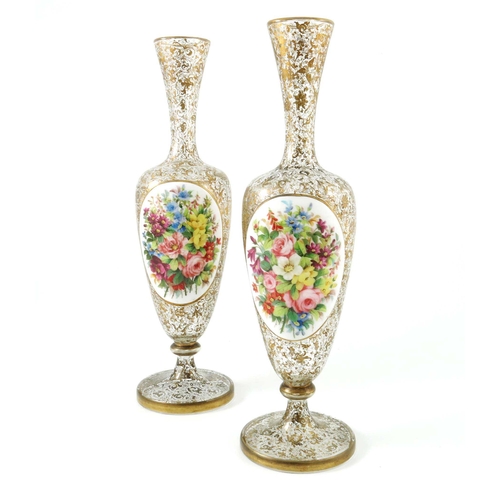 769 - A pair of 19th century Bohemian cased glass portrait vases, shouldered pedestal urn form, colourless... 