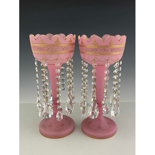 772 - A pair of Victorian pink satin glass lustres, circa 1870, castellated rims, gilt and raised gilt dec... 