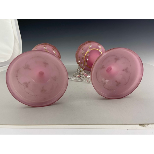 772 - A pair of Victorian pink satin glass lustres, circa 1870, castellated rims, gilt and raised gilt dec... 