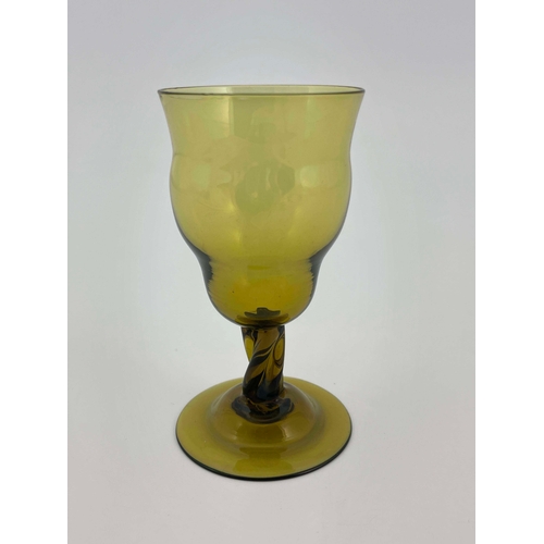 777 - Philip Webb for James Powell and Sons, Whitefriars, an Arts and Crafts green glass wine glass, desig... 