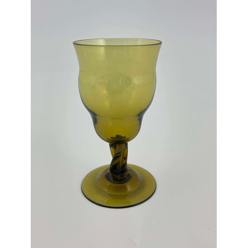 777 - Philip Webb for James Powell and Sons, Whitefriars, an Arts and Crafts green glass wine glass, desig... 