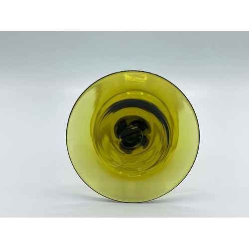 777 - Philip Webb for James Powell and Sons, Whitefriars, an Arts and Crafts green glass wine glass, desig... 