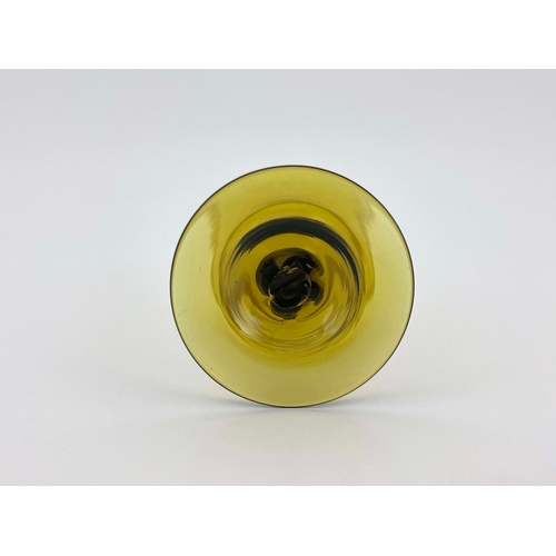 777 - Philip Webb for James Powell and Sons, Whitefriars, an Arts and Crafts green glass wine glass, desig... 