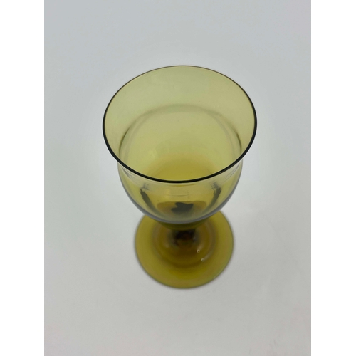 777 - Philip Webb for James Powell and Sons, Whitefriars, an Arts and Crafts green glass wine glass, desig... 