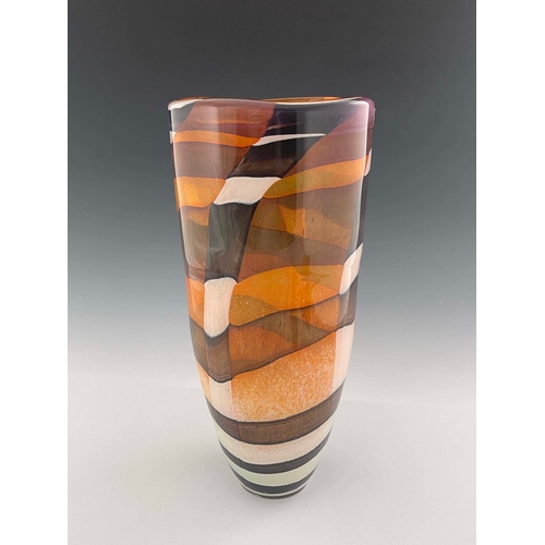 817 - A contemporary studio glass vase, cylindrical form, decorated with brown, black and white patchwork ... 