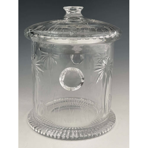 818 - William Yeoward, a clear cut glass ice bucket and cover, side handles, engraved palm tree and scroll... 