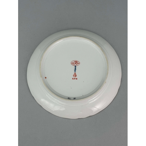 825 - A KPM fruit painted plate depicting quince within relief moulded border, together with a late 19th c... 