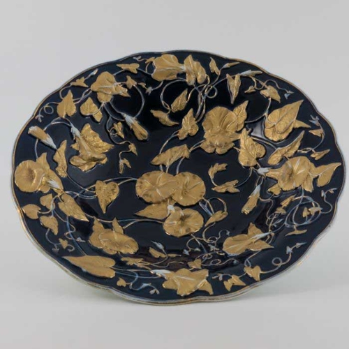 833 - Six early 20th century Meissen dishes, circular form, decorated in high relief with sinuous convolvu... 