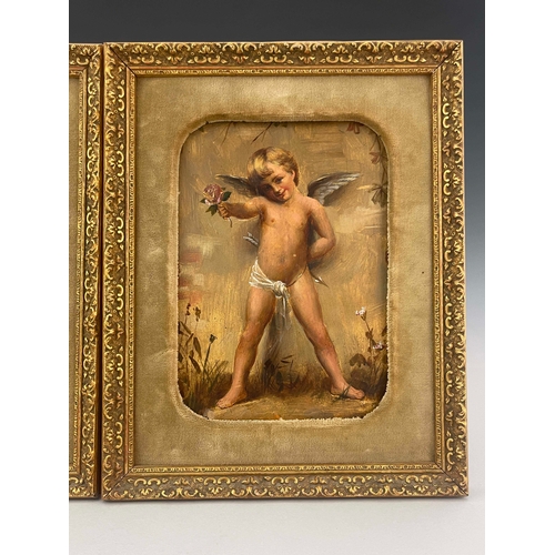 838 - A pair of Goldscheider wall plaques, late 19th Century, each painted with a standing winged cherub, ... 