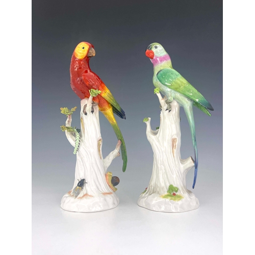 840 - A pair of Dresden porcelain figures of parrots on stumps, relied moulded with sprigs and insects, pa... 