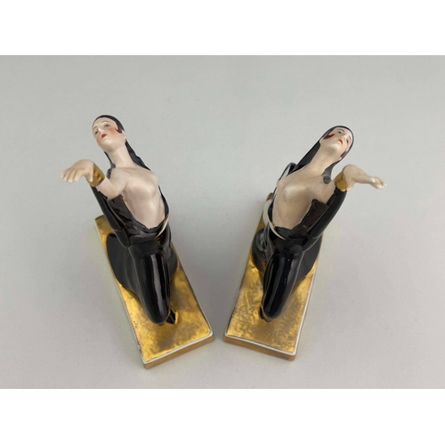 861 - Robj, a pair of Art Deco ceramic bookends, circa 1925, modelled as tambourine dancers, in black high... 