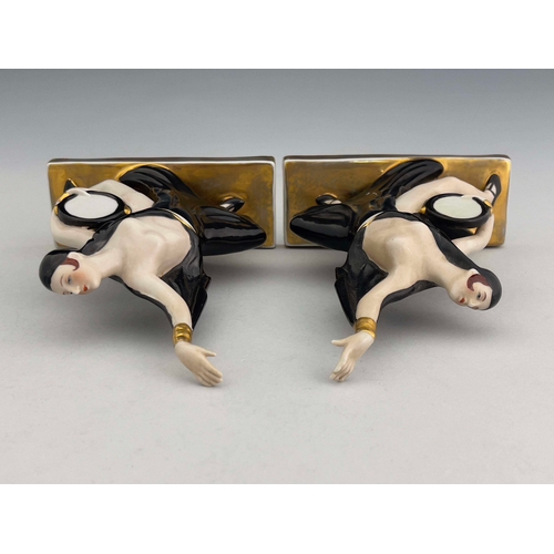 861 - Robj, a pair of Art Deco ceramic bookends, circa 1925, modelled as tambourine dancers, in black high... 