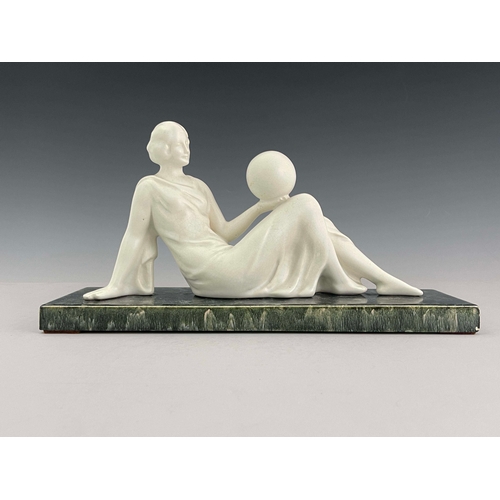 862 - Odyv, an Art Deco ceramic figure, circa 1930, modelled as a reclining woman holding a sphere, white ... 