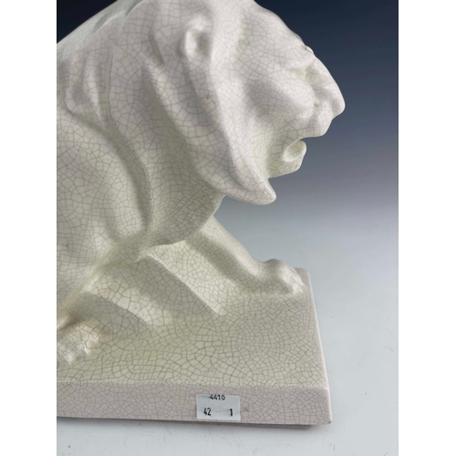 864 - LeJan, Lion Peugeot, an Art Deco ceramic figure, circa 1930, modelled as a striding lion, white craq... 