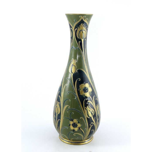 873 - William Moorcroft for James MacIntyre, a large green and gold Florian vase, circa 1903, slender balu... 