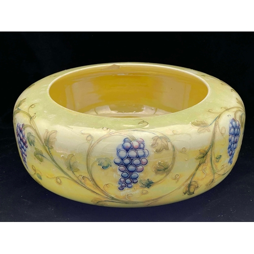 875 - William Moorcroft for Liberty and Co., a Grape lustre bowl, circa 1908, footed rounded drum form, pr... 