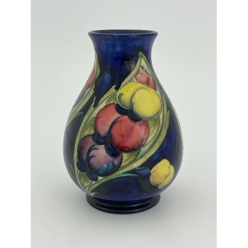 879 - William Moorcroft, a Late Wisteria Frond vase, circa 1930, baluster form, impressed marks, HM the Qu... 