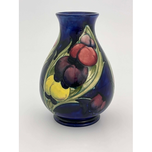 879 - William Moorcroft, a Late Wisteria Frond vase, circa 1930, baluster form, impressed marks, HM the Qu... 