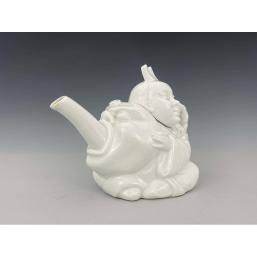 884 - A Minton Aesthetic Movement Blanc de Chine Chinaman teapot, circa 1870s, relief moulded and white gl... 