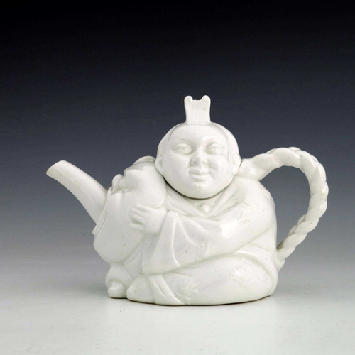 884 - A Minton Aesthetic Movement Blanc de Chine Chinaman teapot, circa 1870s, relief moulded and white gl... 