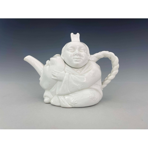 884 - A Minton Aesthetic Movement Blanc de Chine Chinaman teapot, circa 1870s, relief moulded and white gl... 