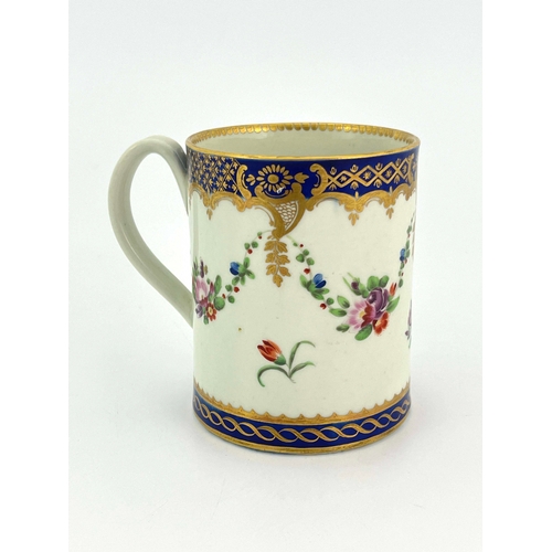 1000 - A Worcester polychrome mug, crescent mark, circa 1780, cylindrical can form, painted with floral gar... 