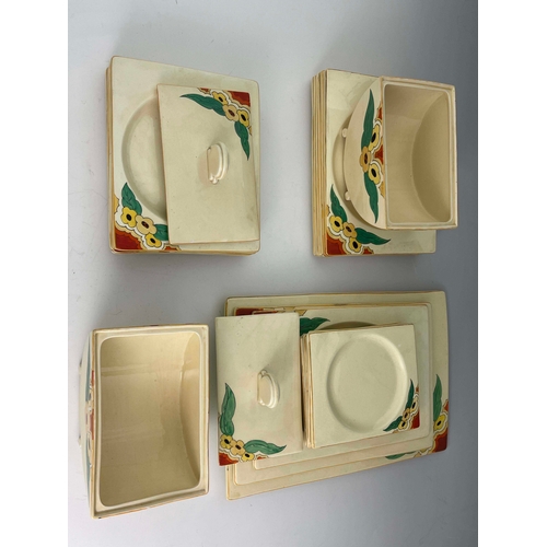 903 - Clarice Cliff for Newport Pottery, an extensive Biarritz dinner service, floral decoration, includin... 