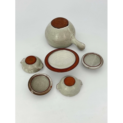 907 - David Leach, a studio pottery soup tureen and cover with two lidded bowls, decorated in wax resist w... 