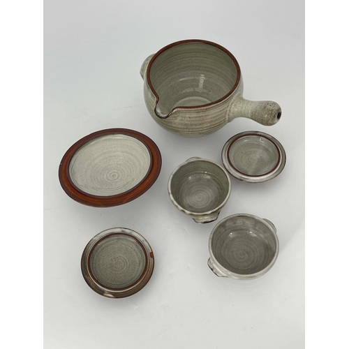 907 - David Leach, a studio pottery soup tureen and cover with two lidded bowls, decorated in wax resist w... 