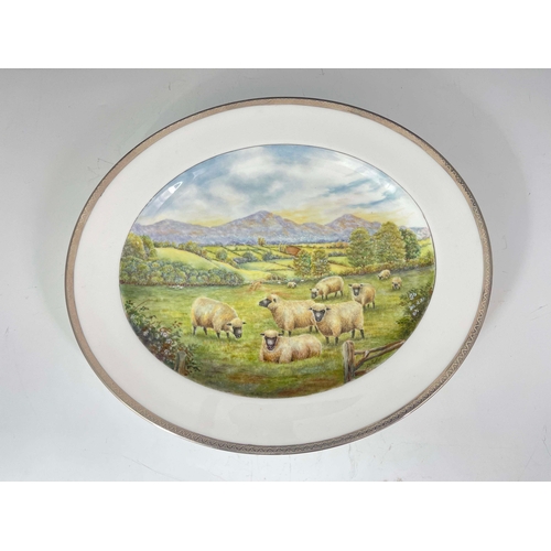 914 - D Fuller for Royal Worcester, a scene painted platter, Malvern, 1964, oval form, decorated with a fi... 