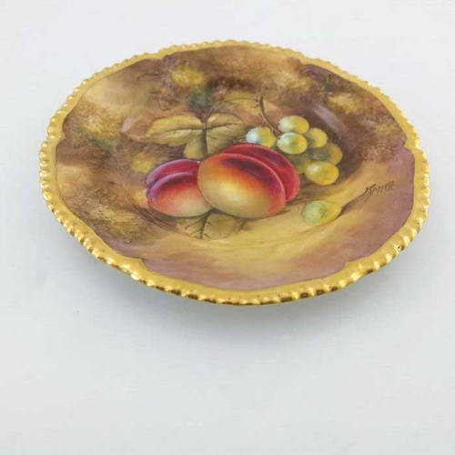 923 - John Smith for Royal Worcester, a fruit painted plate, circa 1960, circular form with gilded lobed a... 