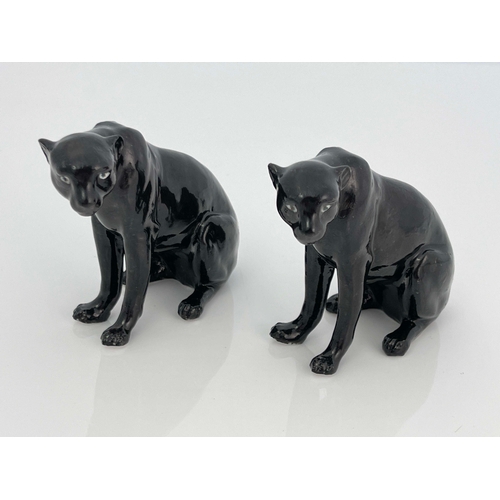 930 - A Royal Worcester pair of figurines, modelled as black panthers, printed marks, 9cm high (2)