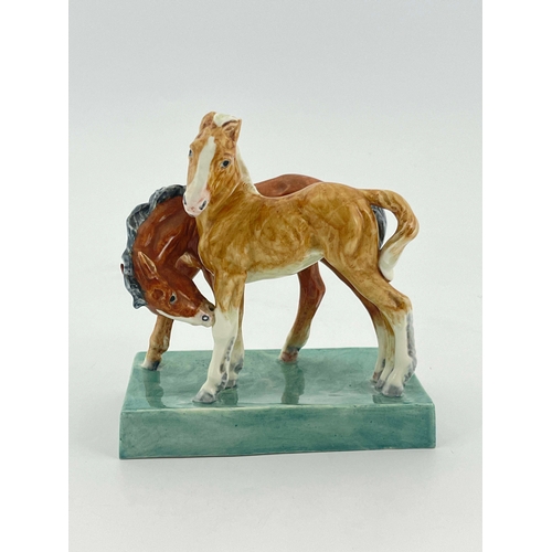 936 - Doris Lindner for Royal Worcester, Foals, figure group model 3152, 1952, on green slab base, 14.5cm ... 