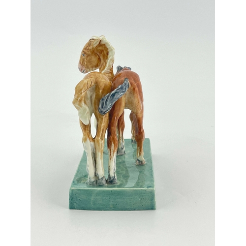 936 - Doris Lindner for Royal Worcester, Foals, figure group model 3152, 1952, on green slab base, 14.5cm ... 