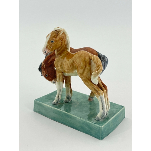 936 - Doris Lindner for Royal Worcester, Foals, figure group model 3152, 1952, on green slab base, 14.5cm ... 