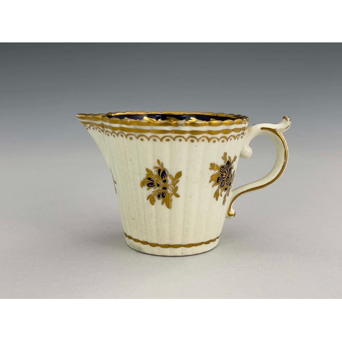 960 - A Caughley reeded jug, S mark, circa 1785, Dresden Flowers design, conical beaker form, underglaze b... 