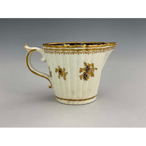 960 - A Caughley reeded jug, S mark, circa 1785, Dresden Flowers design, conical beaker form, underglaze b... 