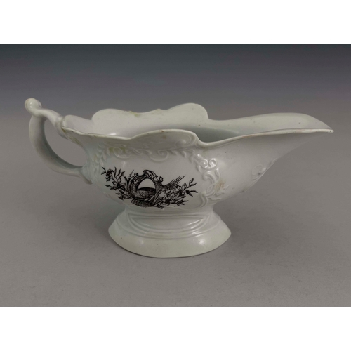 966 - A Worcester black printed high footed sauce boat, circa 1754/55, relief moulded pedestal helmet form... 