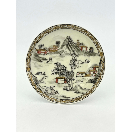 974 - A Worcester black and red pencilled and gilded saucer, circa 1760, decorated with a watery Chinese l... 